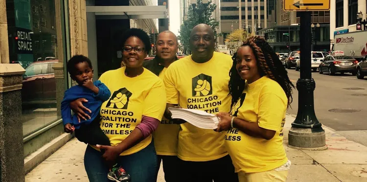 Chicago Coalition for the Homeless activists in bright yellow t-shirts.