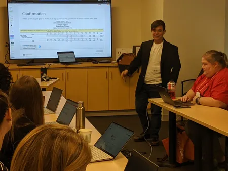 People in a classroom getting trained how to use LegalServer.