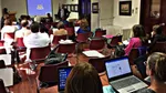 A classroom full of people listening to Uncle Jeff tutoring.