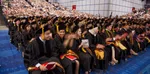 Huge arena filled with students.