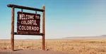 Welcome to colorful Colorado sign in the desert.
